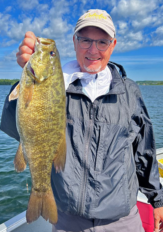 image of paul holding big smallmouth bass