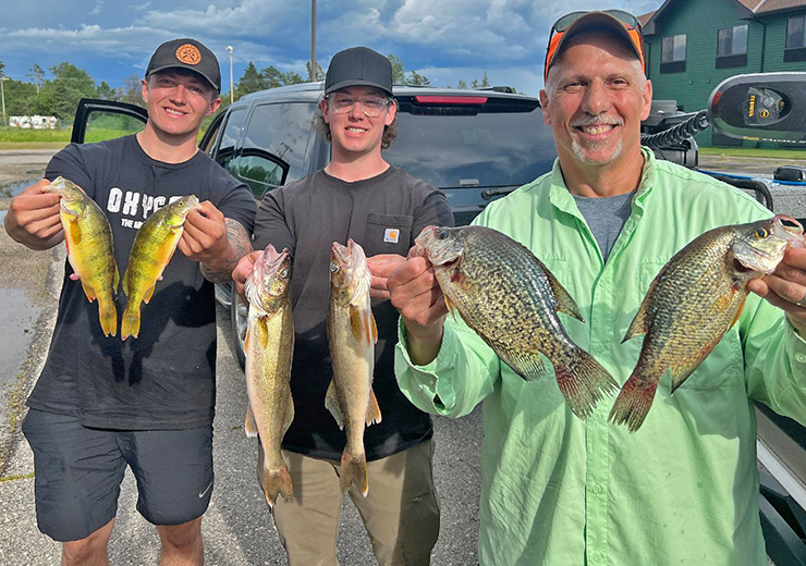 image of James and Josh Blood, along with Phil Goettl after successful fishing trip 