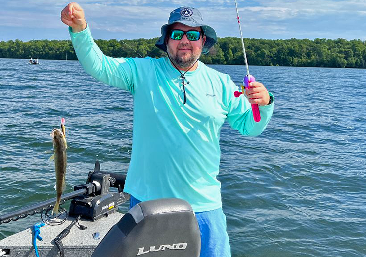 imagfe of Matt McPherson with winnie walleye he caught using a Barbie rod