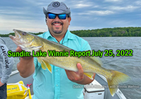 Image of Josh with big winnie walleye caught during thne daikin fish-a-roo