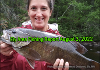 image of woman holding a big smallmouth bass caught near Ely, MN