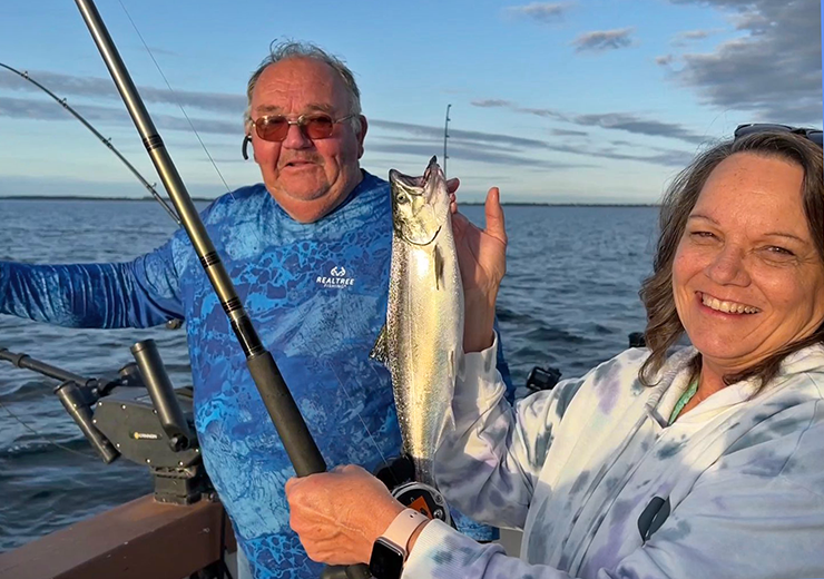 image of the Hippie Chick with salmon caught on Lake Superior, near Duluth