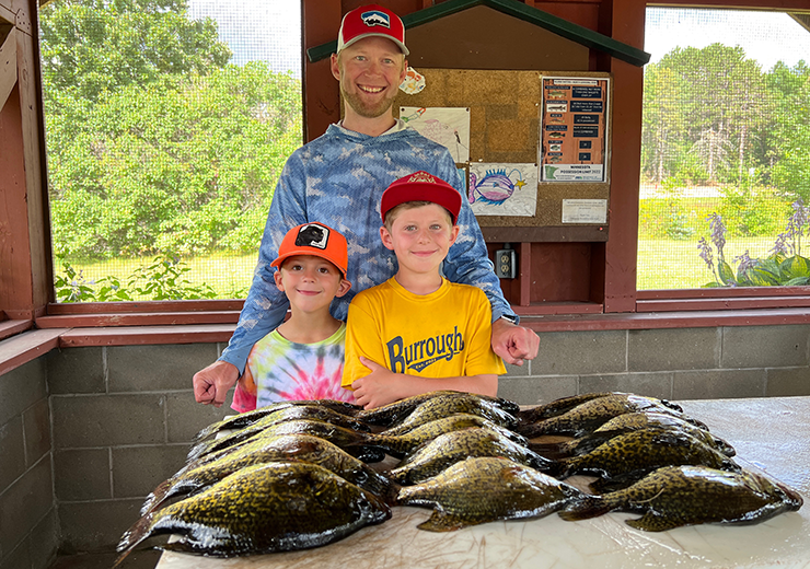 image of John Hauschild and sons with nice catch of crappies
