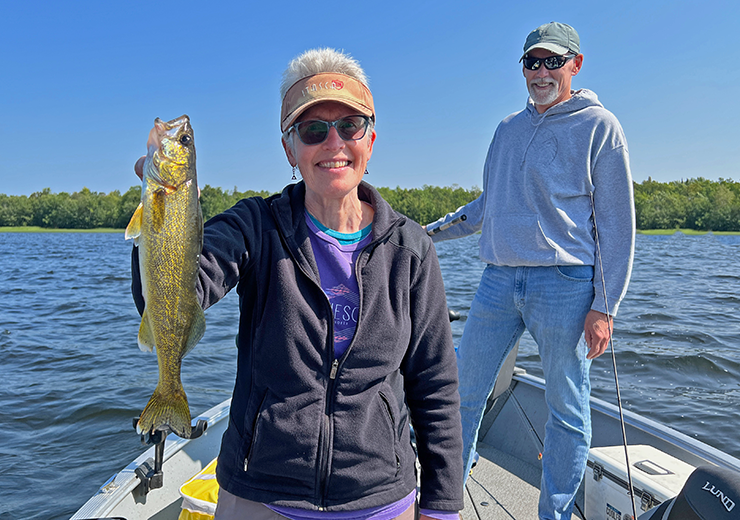 image of Donna Drummond with nice walleye caught on a Grand Rapids area lake