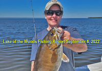 image of Eva Van Langen holding big smallmouth bass links to fishing report from lake of the woods