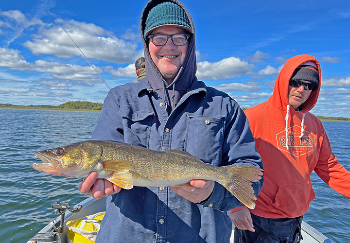 image of mark holding nice waleye caught on Lake Winnie