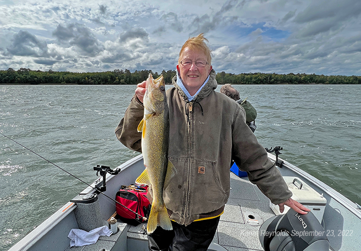 image of Karen Reynolds with big walleye caught on Lake Winnie