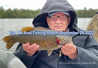 image of man holding nice smallmouth bass caught in the Ely Minnesota area