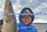 image of young boy holding monster walleye caught on Lake of the Woods