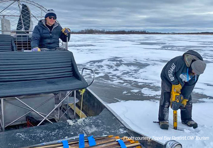 image of Zippel Bay staff checking ice conditions on Zippel Bay