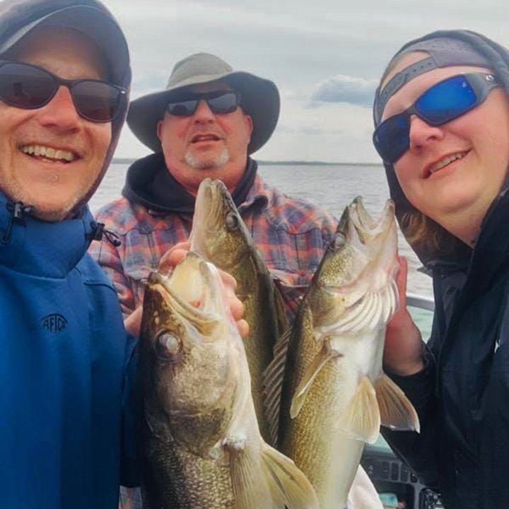 image of anglers with a lake of the woods walleye triple 