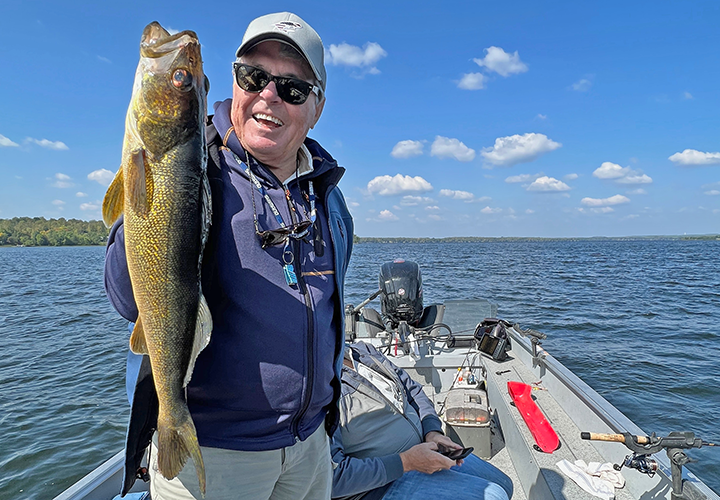image of Dick Williams with big walleye caught on fishing charter with Jeff Sundin 