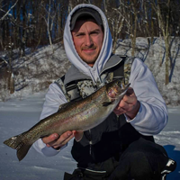 image of Cody Mueller with rainbow trout