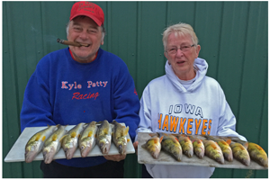 image of karen and kyle reynolds with perch and walleye