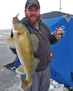 image of bob bohland with red lake walleye