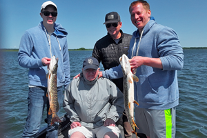 image of kelly family with northern pike