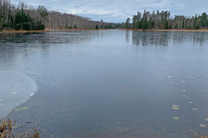 image of ice covering small lake