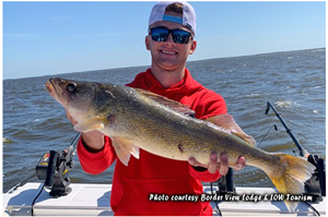 image of fisherman with big walleye