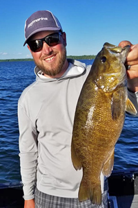 image of justin wiese with big smallmouth