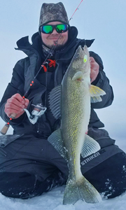 image of shane boeshart with big walleye