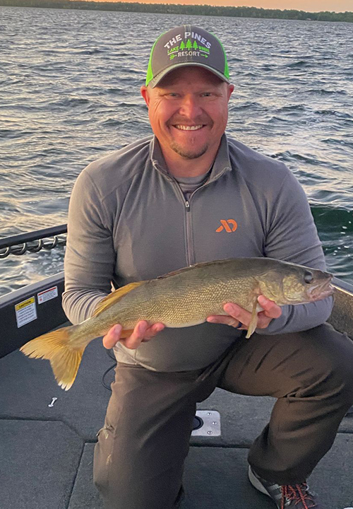 image of angler with nice winnie walleye