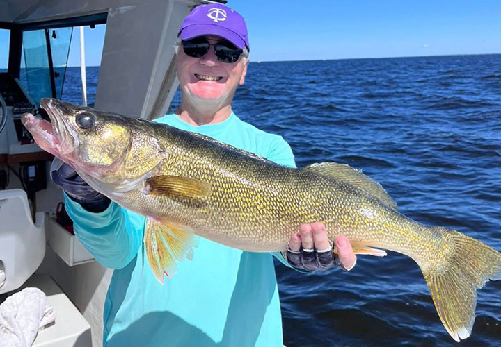 image of walleye fisherman on Lake of the Woods with huge walleye