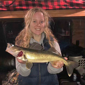 image of woman with walleye links to lake winnie fishing report