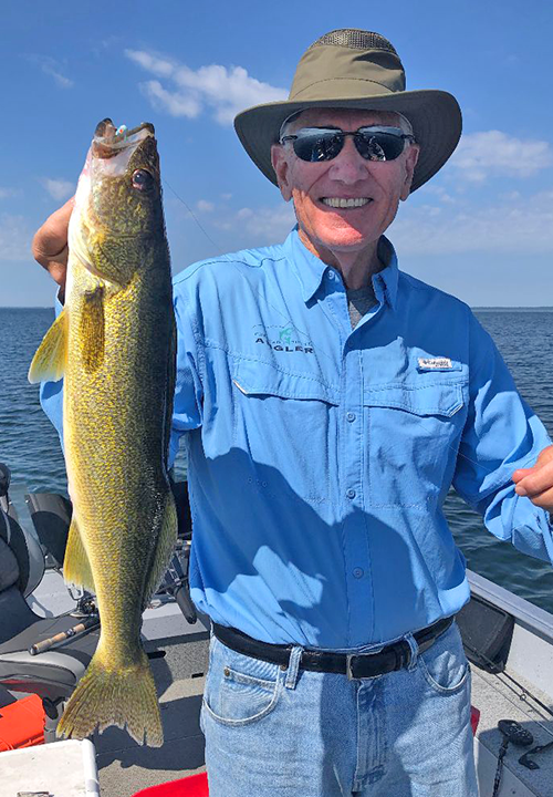 image of Jim Miller holding nice lake winnie walleye 