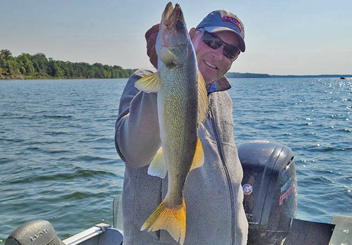 image of Jeff Sundin with nice walleye caught on lake winnie