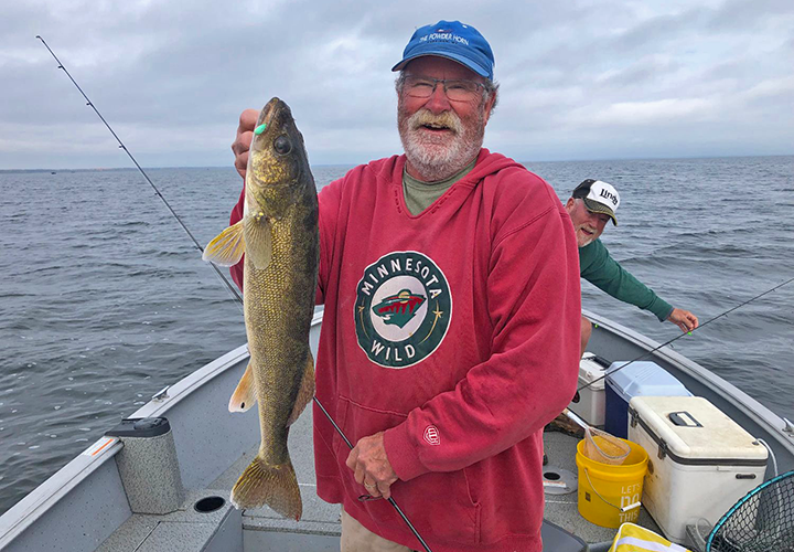 image of Mike Colley with nice walleye caught on Lake Winnibigoshish