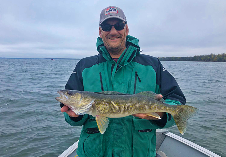 image of brent with nice walleye caught on lake winnie
