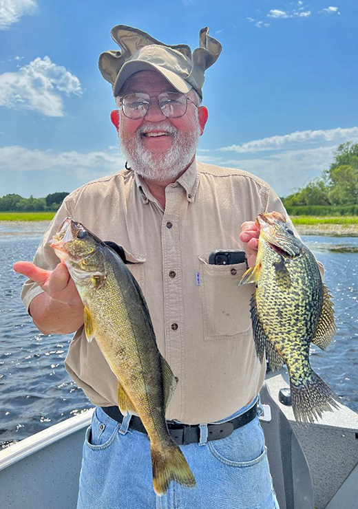 image of Ken Seufert with crappie and walleye caught on the Mississippi River