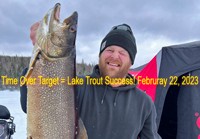 image of Pat Everson holding big lake trout caught ice fishing 