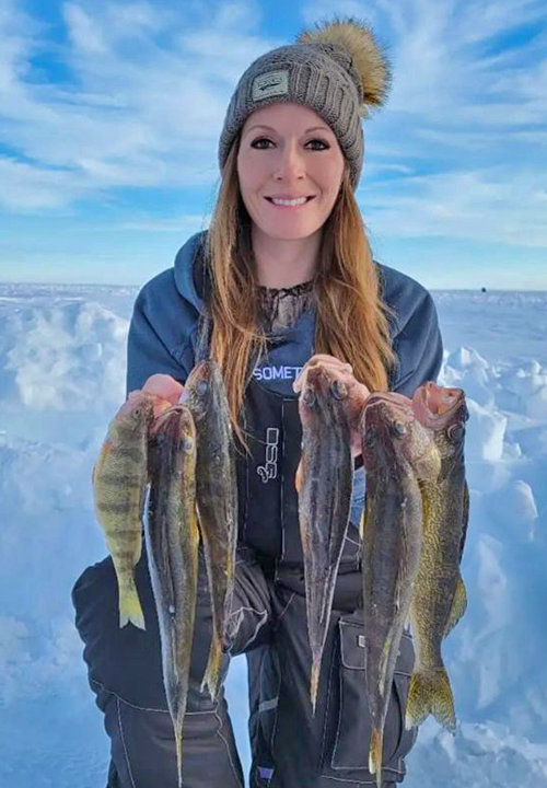 image of woman holding nice walleyes she caught on Lake of the Woods