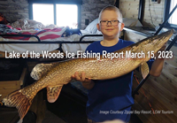image of young boy holding huge northern pike caught in Zippel Bay
