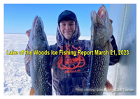 image of ice fisherman holding 2 huge pike caught on Lake of the Woods