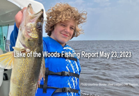 image of young angler holding huge walleye caught on lake of the woods