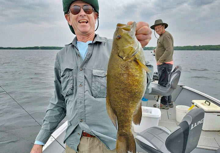 image of Brian Shileds with big smallmout bass 
