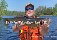 image of fisherman holding large walleye