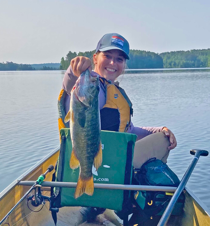 image of woman holding nice smallmouth bass