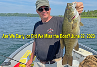 image of Mark holding a big smallmouth bass caught on a fishing charter with Jeff Sundin