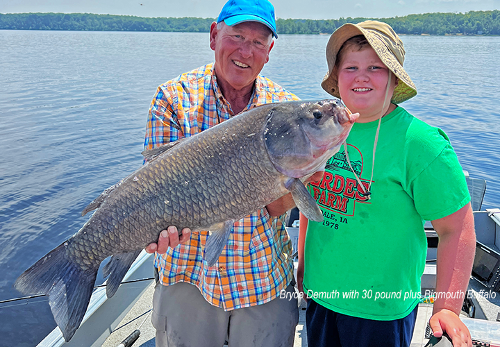 image of Bryce Demuth and Fishing Guide Jeff Sundin holding huge fish