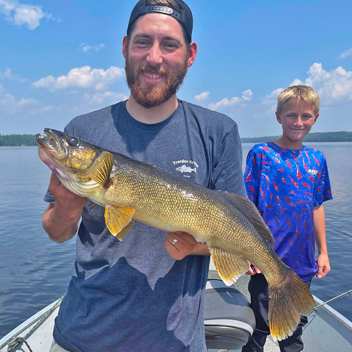 image of man holding large walleye 