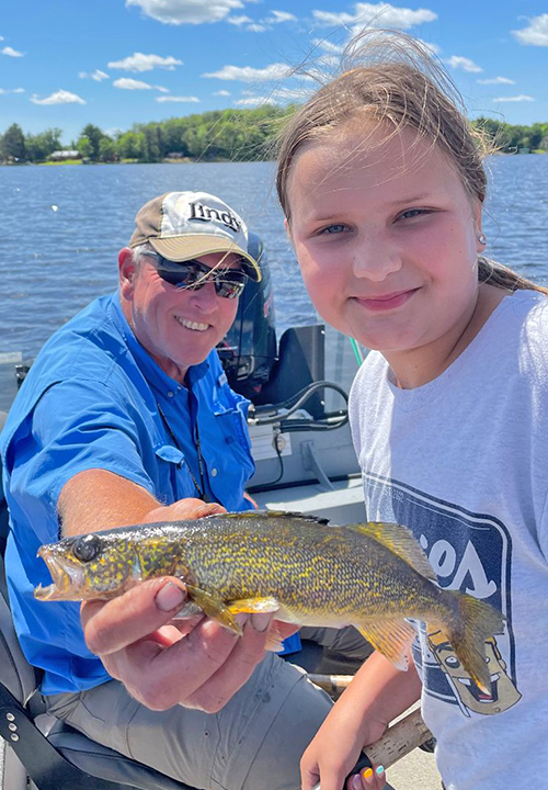 image of Sydney Pries with eater walleye caught on Big Sandy Lake