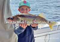 image of youngster on charter boat showing off his big walleye