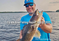 image of man holding big walleye caught in the Ely MN region