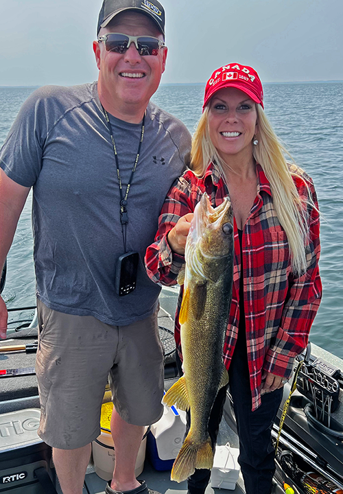 image of Mike and Lisa Lindholm with big walleye