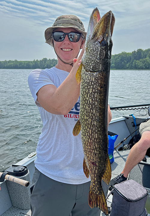 image of Leanne Praska holding big northern pike