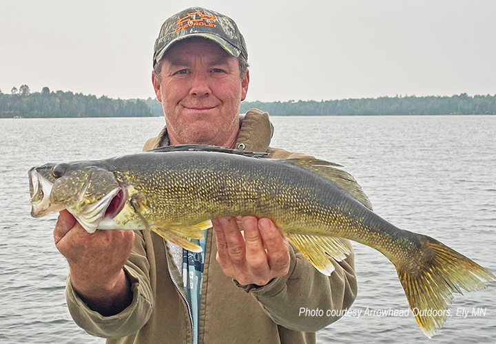 image of angler holding nice walleye