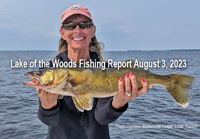 image of woman holding big walleye she caught on Border View Lodge charter fishing trip